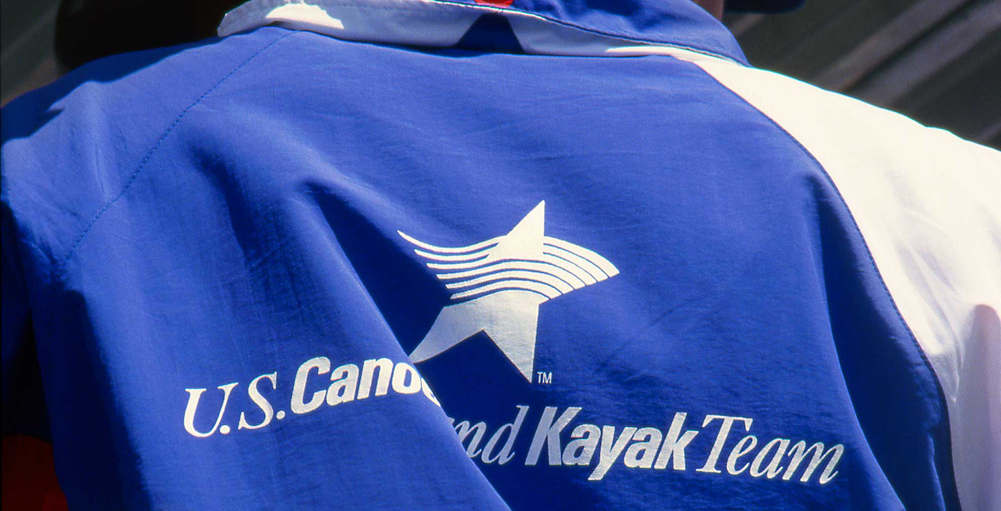 us_canoe-and-kayak-team_blue-jacket.jpg Art Direction by: Bart Crosby, Crosby Associates